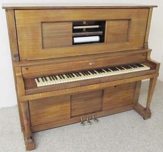 antique player piano in Piano