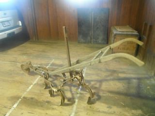 Antique Horse drawn plows and cultivator
