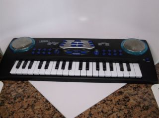 First Act light up Keyboard electronic 37 keys 8 tones 8 rhythms 