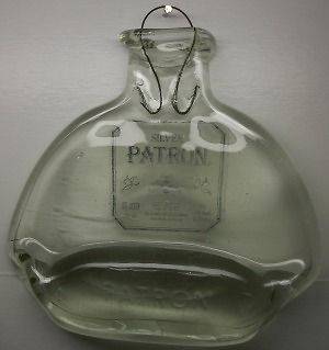 melted silver patron tequila bottle with wire