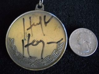 UNKNOWN MEDAL AUTOGRAPHED BY HULK HOGAN, STORAGE AUCTION FIND