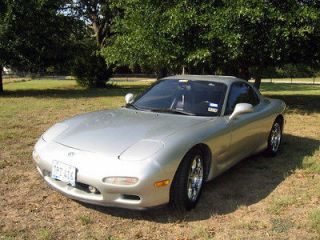   stock (unmodfied) 93 Mazda RX7 Touring 5 spd, will need motor rebuild