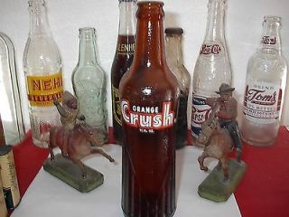 AN EXCELLENT EMPTY ACL 12 OZS AMBER GLASS ORANGE CRUSH SODA BOTTLE .