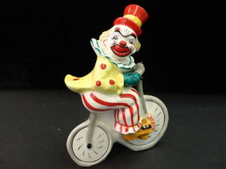 YONA ORIGINAL CLOWN RIDING BICYCLE   PORCELAIN (5.5 INCHES x 4 INCHES)