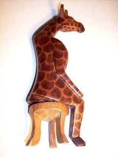 kenya wood carved interesting humorous figurine of giraffe returns 