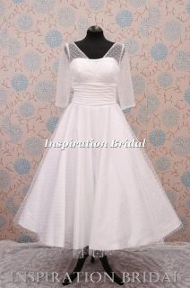   short tea length knee length polka dot wedding dress with long sleeves