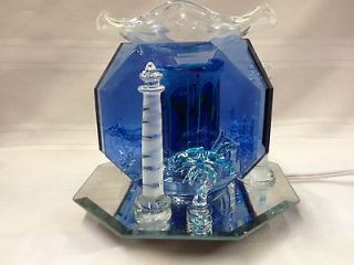 lighthouse with dolphins electric tart or oil warmer time left