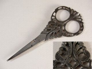 Details A pair of late Victorian steel sewing scissors with pierced 