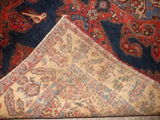 This is a colorful antique Persian trial area rug with pole medallion 