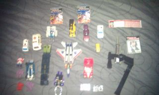 Lot of vintage Transformers action figures weapons and accessories