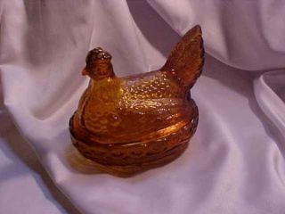 le smith amber hen on nest covered dish