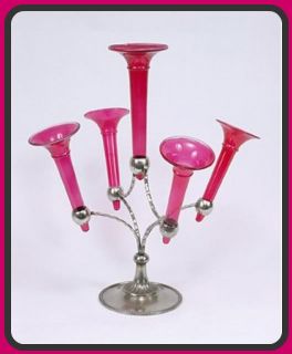   styled epergne with cranberry glass bud vases that are removeable