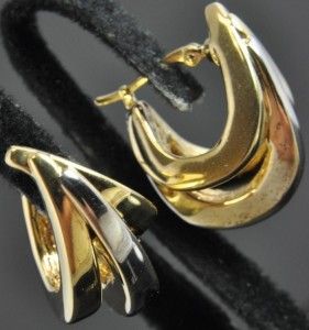   of hoop earrings by Carla crafted from solid 14K yellow & white gold