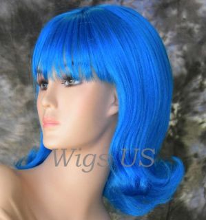 Neon Blue 60s Style Back Comb Look Bangs Center Part Flipped Ends 