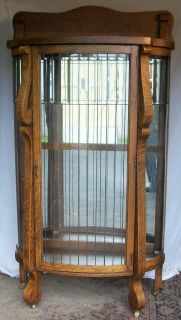 oak china cabinet with leaded glass door and sides