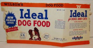 ideal dog ad figure is holding label has some tears along the edges