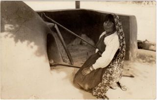 Real Photo Postcard of An Indian Woman Cooking Bread in A Clay Oven