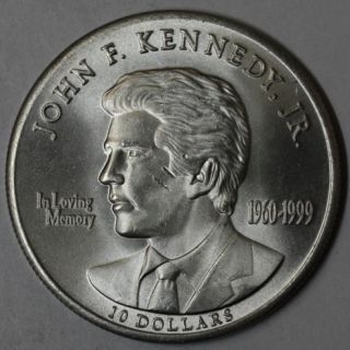 John F KENNEDY Jr ** IN LOVING MEMORY ** $10 coin BU (LOT D)