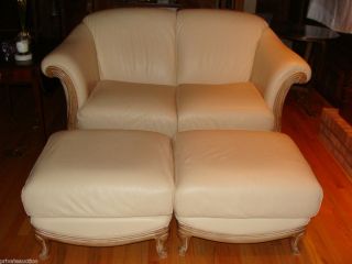NATUZZI PAIR OF LEATHER LOVESEATS WITH PAIR OF MATCHING OTTOMANS MADE
