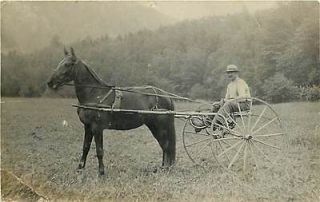 REAL PHOTO MAN IN HORSE DRAWN CART GIANT WHEELS K40107