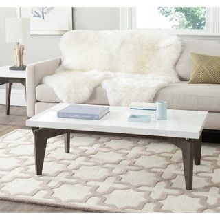 Safavieh Josef White/ Dark Brown Lacquer Coffee Table (White/ Dark BrownMaterials: Stainless steel and MDFFinish: White and Dark BrownDimensions: 15 inches high x 43.3 inches wide x 23.6 inches deepThis product will ship to you in 1 box.Assembly required 